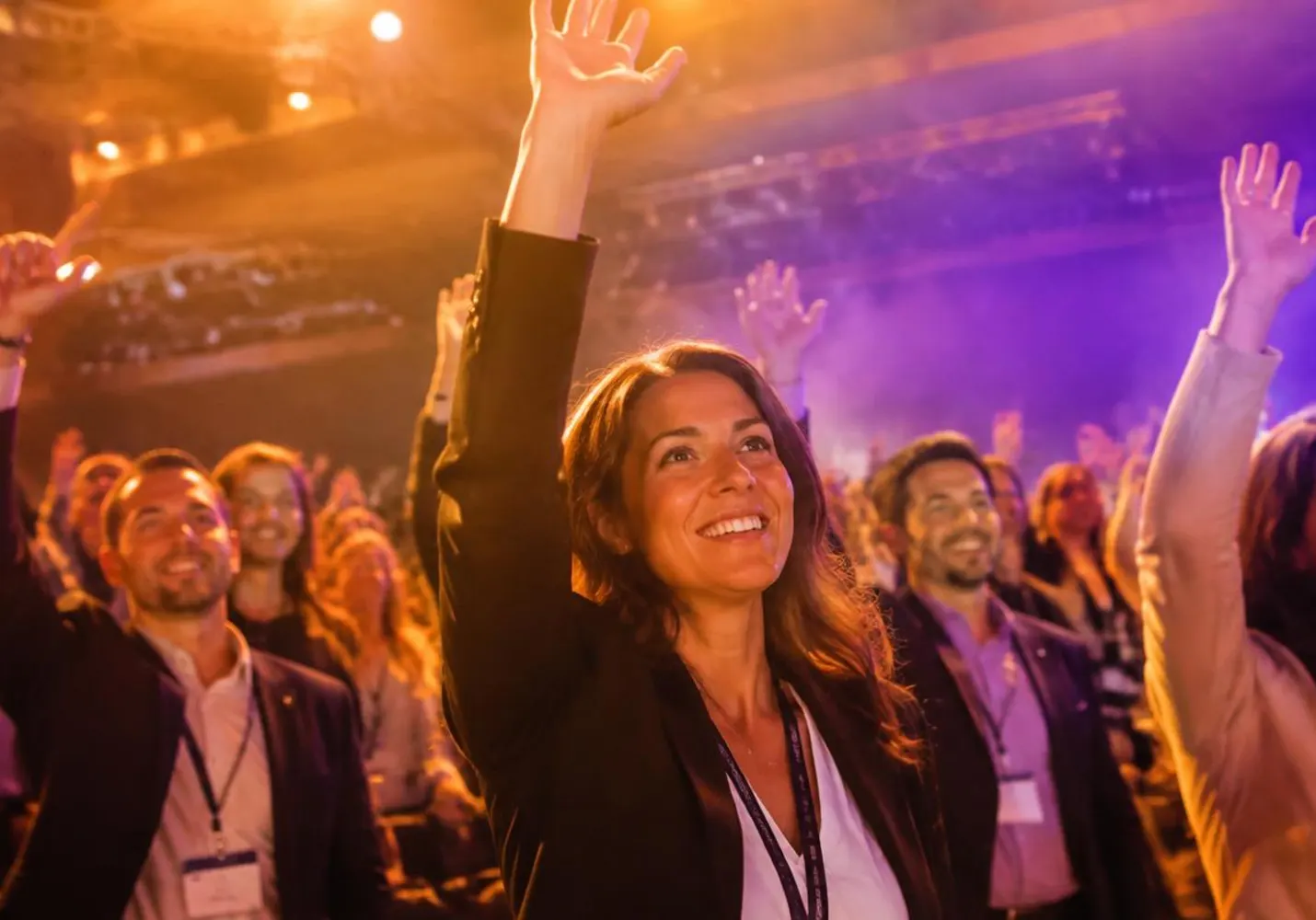 Audience members raising their hands