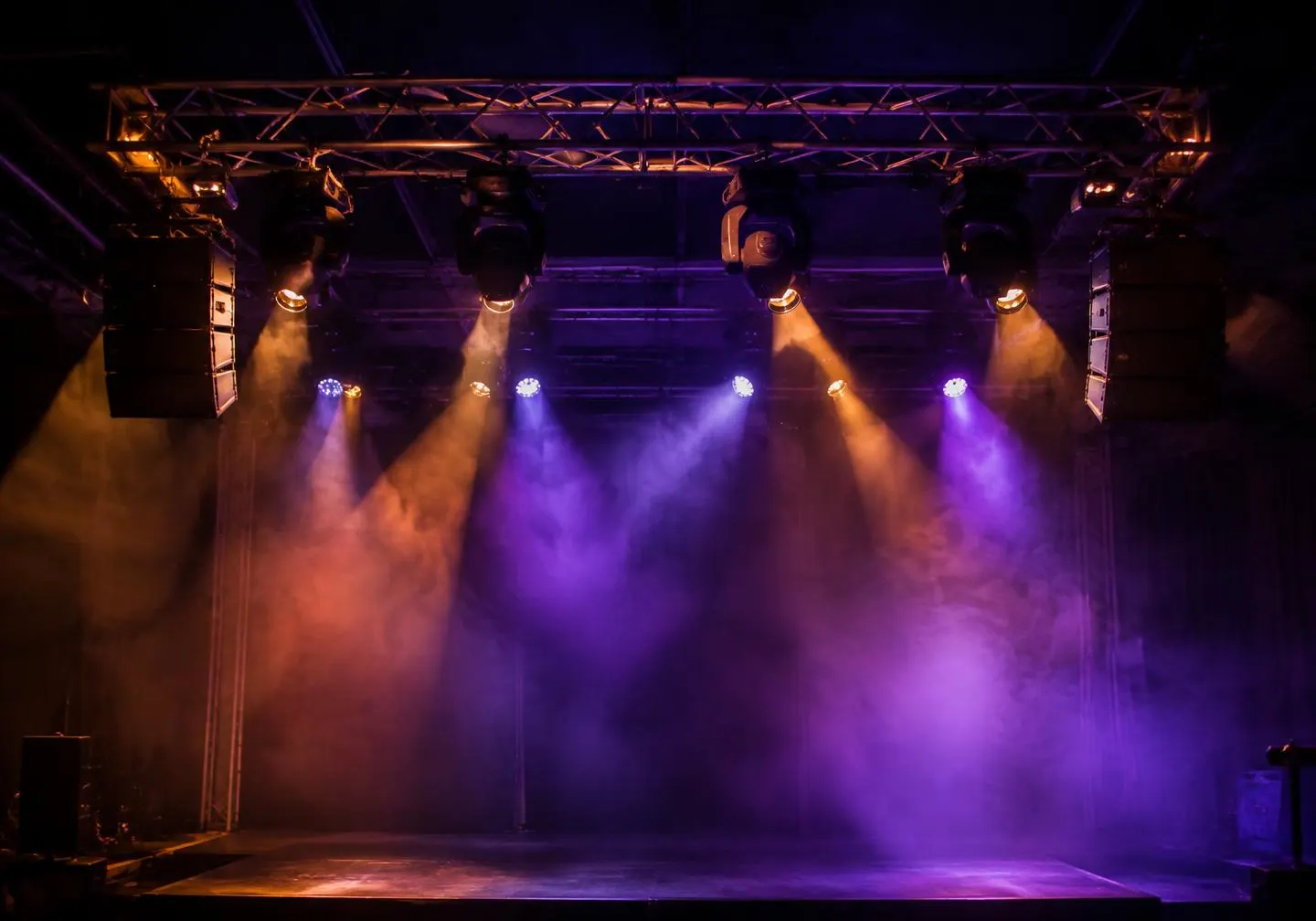 Lighting rig and speakers above a stage